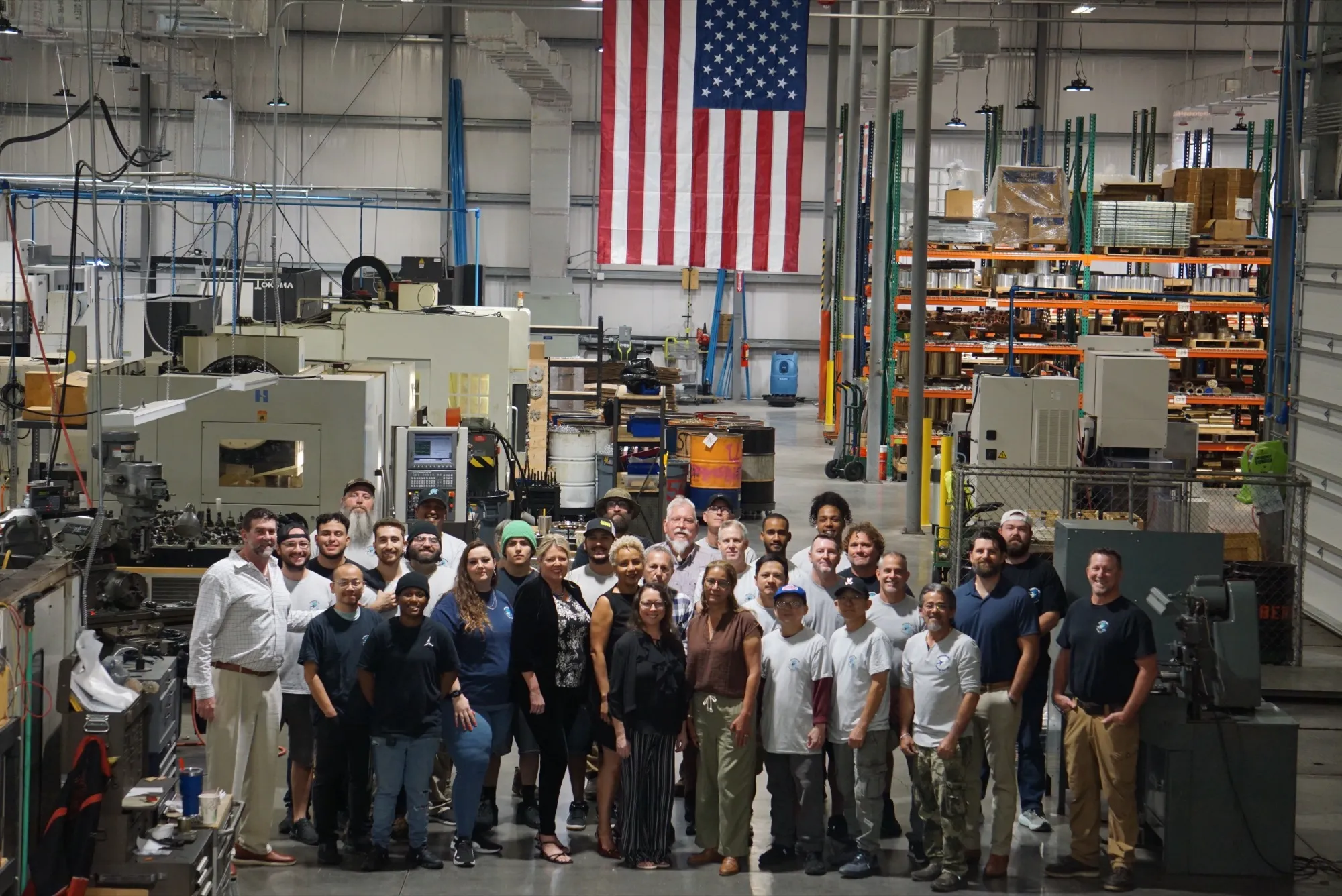 Advanced Air team with an American flag at the Jupiter, Florida facility
